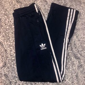 Blue and white striped adidas track pants